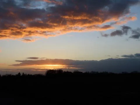 Sunset with red clouds Stock Photos