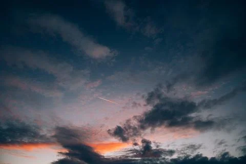 Sunset Red Orange Dark dramatic Colourful Clouds Stock Photos
