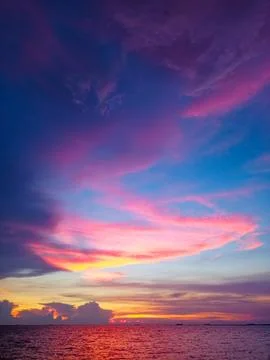 Sunset red orange purple cloud on light and dark blue sky Stock Photos