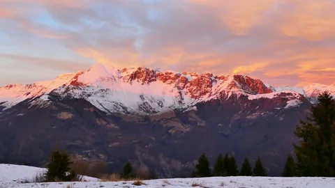 Sunset red reflection on mountain range - pan right Stock Footage 83946299