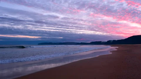 Sunset at red sands beach Stock Footage 249479395