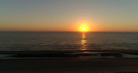 Sunset Red Sky Beach Moving Left, Noordwijk, Netherlands / Holland (4K Drone) Stock Footage 114708777