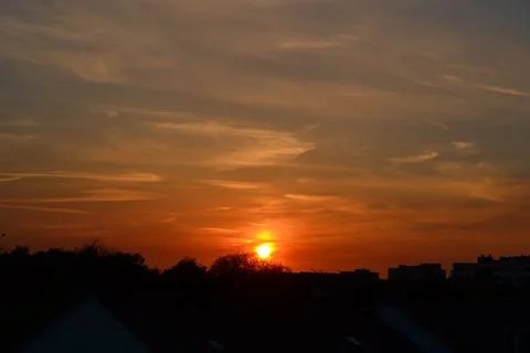 Sunset with reddish and blue clouds in central Europe Stock Photos