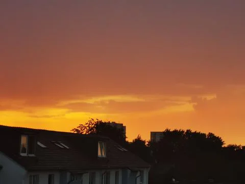 Sunset with reddish and blue clouds in central Europe Stock Photos