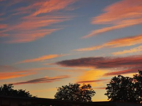 Sunset with reddish and blue clouds in central Europe Stock Photos