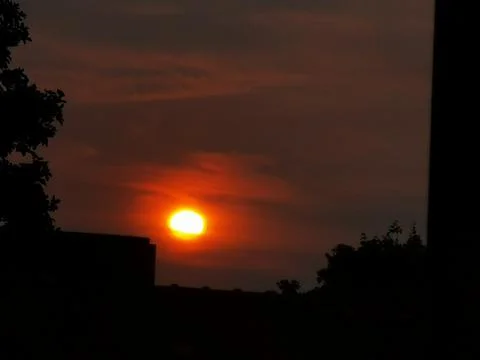 Sunset with reddish and blue clouds in central Europe Stock Photos