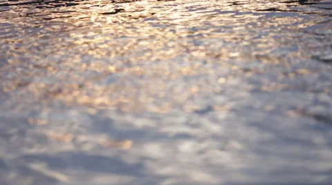 SUNSET REFLECTED ON CALM RIVER SURFACE – PAN UP Stock Footage 53282291