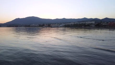 Sunset reflected on the calm waters of the sea on the Costa del Sol. Video stock 287577375