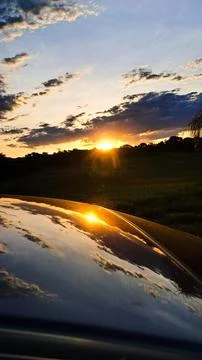 Sunset reflected in a car. Stock Photos
