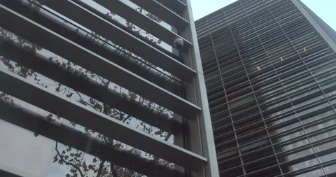 Sunset is reflected in the glass facade of the office building. Stock Footage 280513927