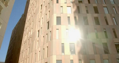 Sunset is reflected in the glass facade of the office building. Stock Footage 297294417