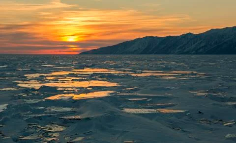 Sunset reflected in the ice floes Fotos Stock