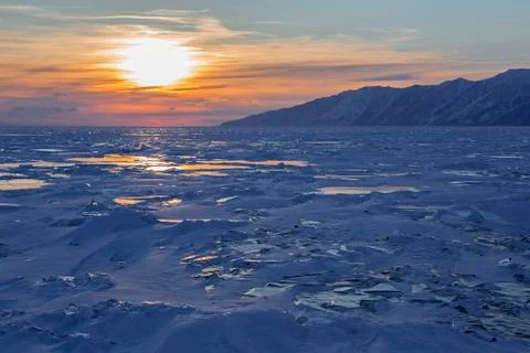 Sunset reflected in the ice floes Stock Photos