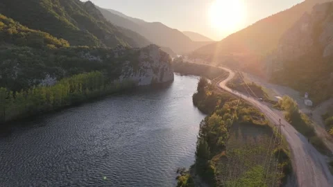 Sunset Reflected River Valley with Road Alongside – Cinematic Landscape Stock-Footage 337253687
