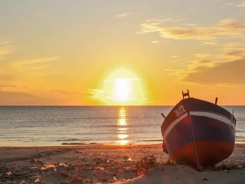 Sunset reflected on sea with incoming waves Stock Footage 76014452