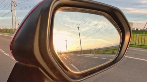 Sunset reflected in side mirror Stock Footage 242925782