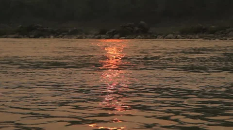 Sunset reflected in the water, Mekong river. Shot from a moving boat. Stock Footage 38286594