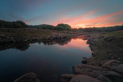 Sunset reflected in the waters of the river Stock Photos