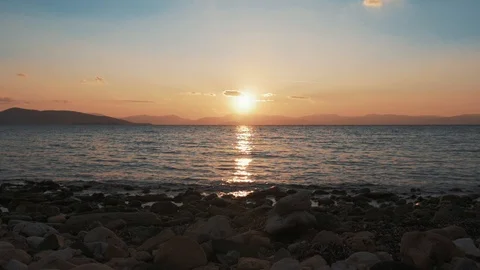 Sunset reflected in waves on golden hour. Slow motion shot. Stock Footage 105267007