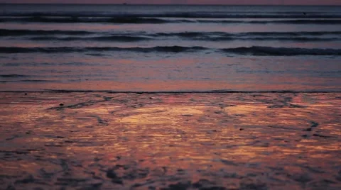 Sunset reflected on wet sand Stock Footage 56747148