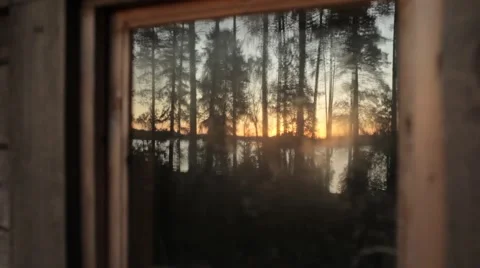 Sunset Reflected in the Window on the Lake in the Woods Video stock 67431360