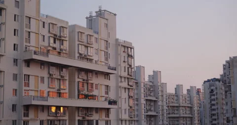Sunset reflected in the windows of a residential building in the evening Video stock 162054729