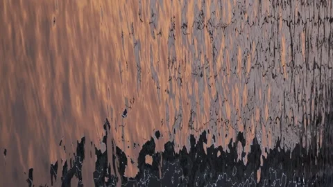 Sunset reflecting in bubbling water of river in evening Stock Footage 267031492