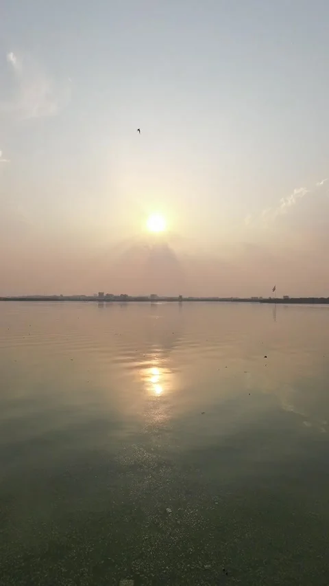 Sunset Reflecting On Calm Tranquil Lake During The Sunset Time Vertical Video Stock Footage 306345689