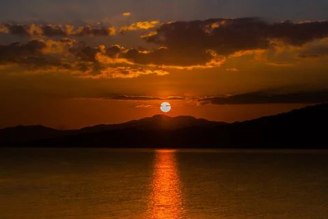 Sunset reflecting in dam Stock Photos