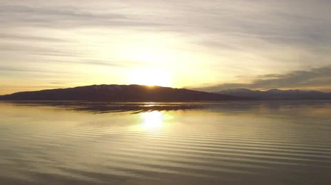 Sunset Reflecting on a Lake Stock Footage 63357213
