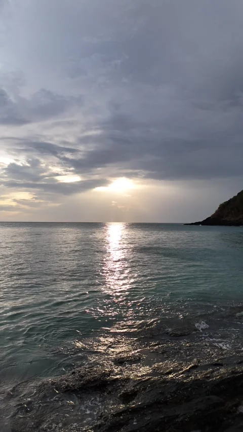 Sunset Reflecting on the Ocean Water in Koh Lanta, Thailand Stock Footage 335951115