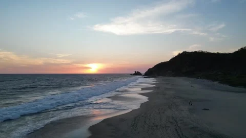 Sunset Reflecting Over Long Ocean Ripples Near the Shore Mazunte Mexico Stock Footage 321707815