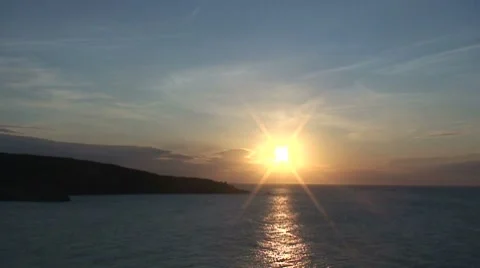 Sunset reflecting over sea- time lapse Stock Footage 8627996