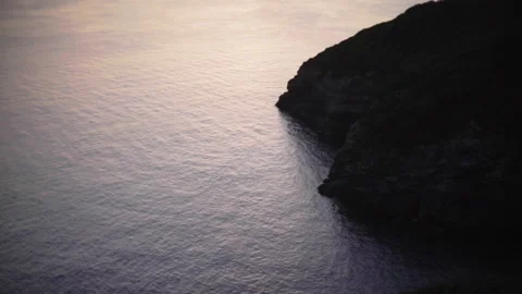 Sunset reflecting on the sea Stock Footage 130192091