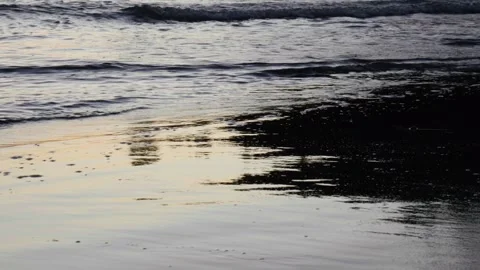 Sunset reflecting off the shore Stock Footage 260850432