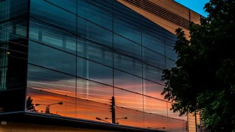 Sunset Reflecting On The Windows Of A Building Stock Photos