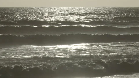 Sunset Reflection off Beach Waves Stock Footage 155116595