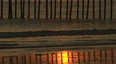 Sunset Reflection Below Pier in California Stock Footage 688636