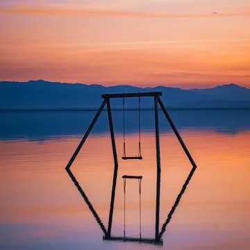 Sunset Reflection at Bombay Beach with Swing in the middle Stock Photos