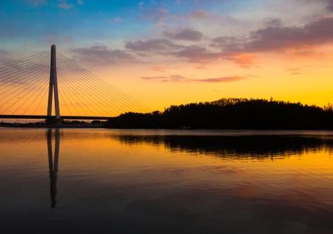 Sunset reflection of a bridge and a river Stock Photos