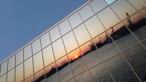 Sunset reflection on building mirror glass windows. Urban landscape. Stock Footage 114510571
