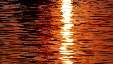 Sunset Reflection Forming Bright Vertical Strip on Rippling Sea Stock Footage 321924923