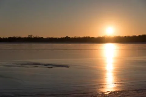 Sunset Reflection on Frozen Lake Stock Photos