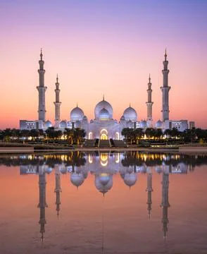 Sunset Reflection of Grand Mosque on Tranquil Waters Stock Photos