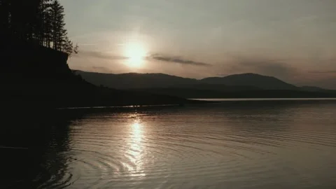 Sunset reflection on a lake in Montana in summer Stock Footage 313259293