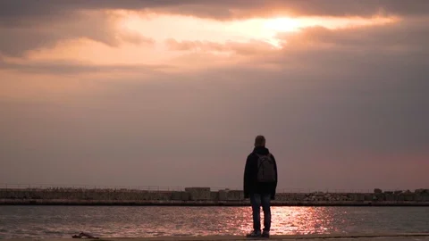 Sunset reflection man alone staring 1080p Stock Footage