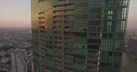 Sunset Reflection On Modern Condominium Highrise, Bangkok, Thailand, Aerial Video stock 79295033