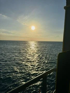 Sunset Reflection on Open Ocean Viewed from Cargo Ship Stock Photos