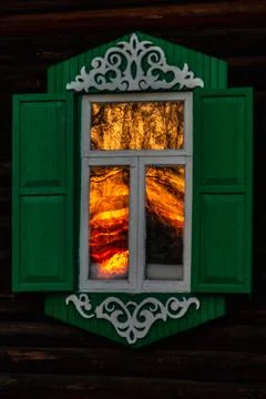 Sunset Reflection in Ornate Window Stock Photos