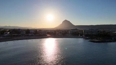 Sunset Reflection over the Bay near Montgo Mountain, Javea Spain Stock Footage 340300873